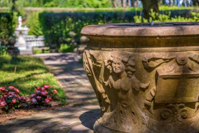 Porphyry marble well-head mount. Renaissance, Italy. Part of the Whitney Collection at The Elizabethan Gardens.